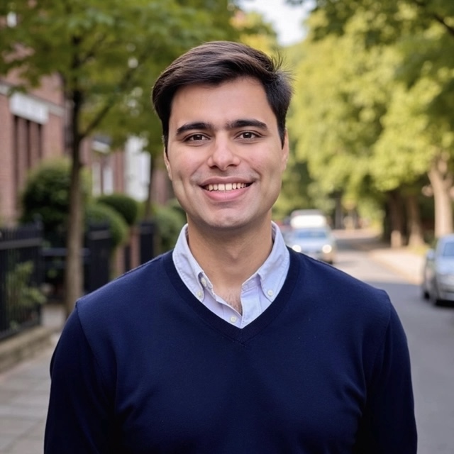 Varun Chopra in London wearing a navy sweater